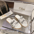 WOODY SLIPPER IN WHITE MIX BLACK CANVAS
