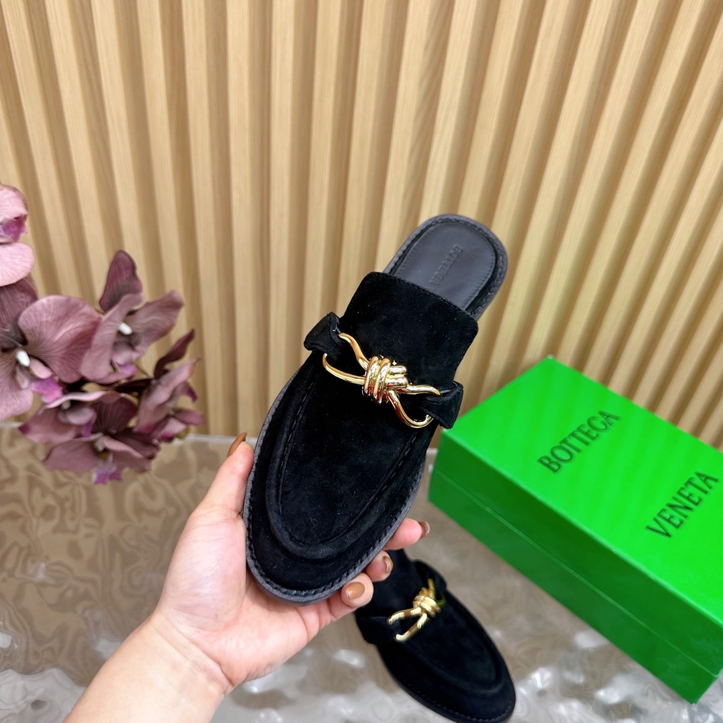 BOTTEGA VENETA OPEN-BACK LOAFER REALISED IN BLACK SUEDE WITH SIGNATURE METALLIC KNOT DETAIL