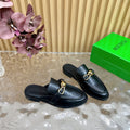 BOTTEGA VENETA OPEN-BACK LOAFER REALISED IN BLACK SOFT CALFSKIN WITH SIGNATURE METALLIC KNOT DETAIL
