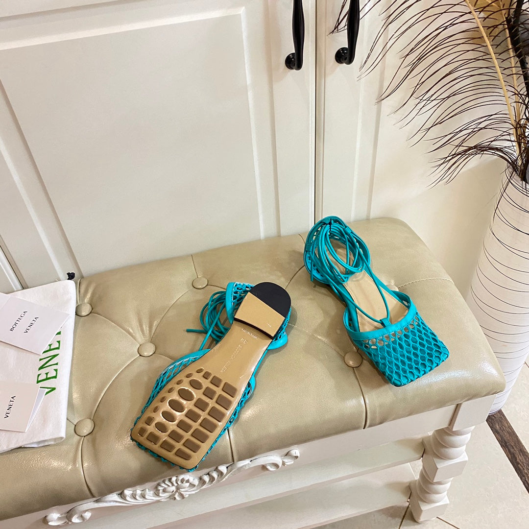 BOTTEGA VENETA STRETCH LACE-UP FLAT SANDAL IN CERULEAN BLUE METALLIZED MESH AND LEATHER