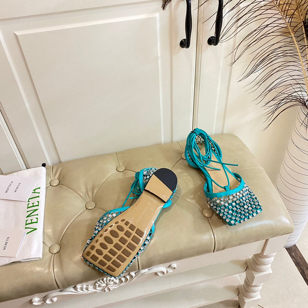 BOTTEGA VENETA LACE-UP FLAT SANDAL IN CERULEAN BLUE METALLIZED MESH AND LEATHER WITH RHINSTONES