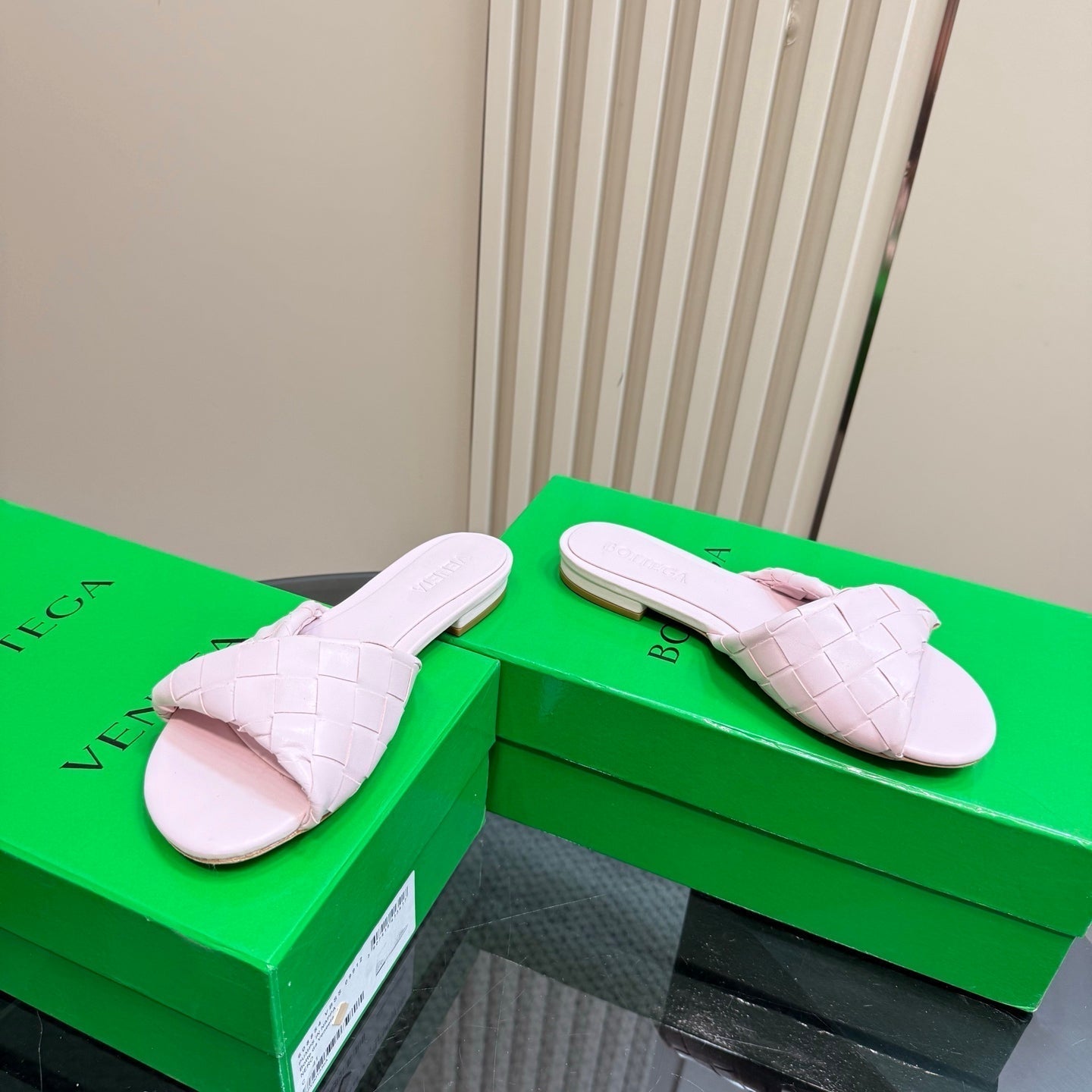 BOTTEGA VENETA BLINK FLAT MULE IN LIGHT PINK INTRECCIATO LEATHER