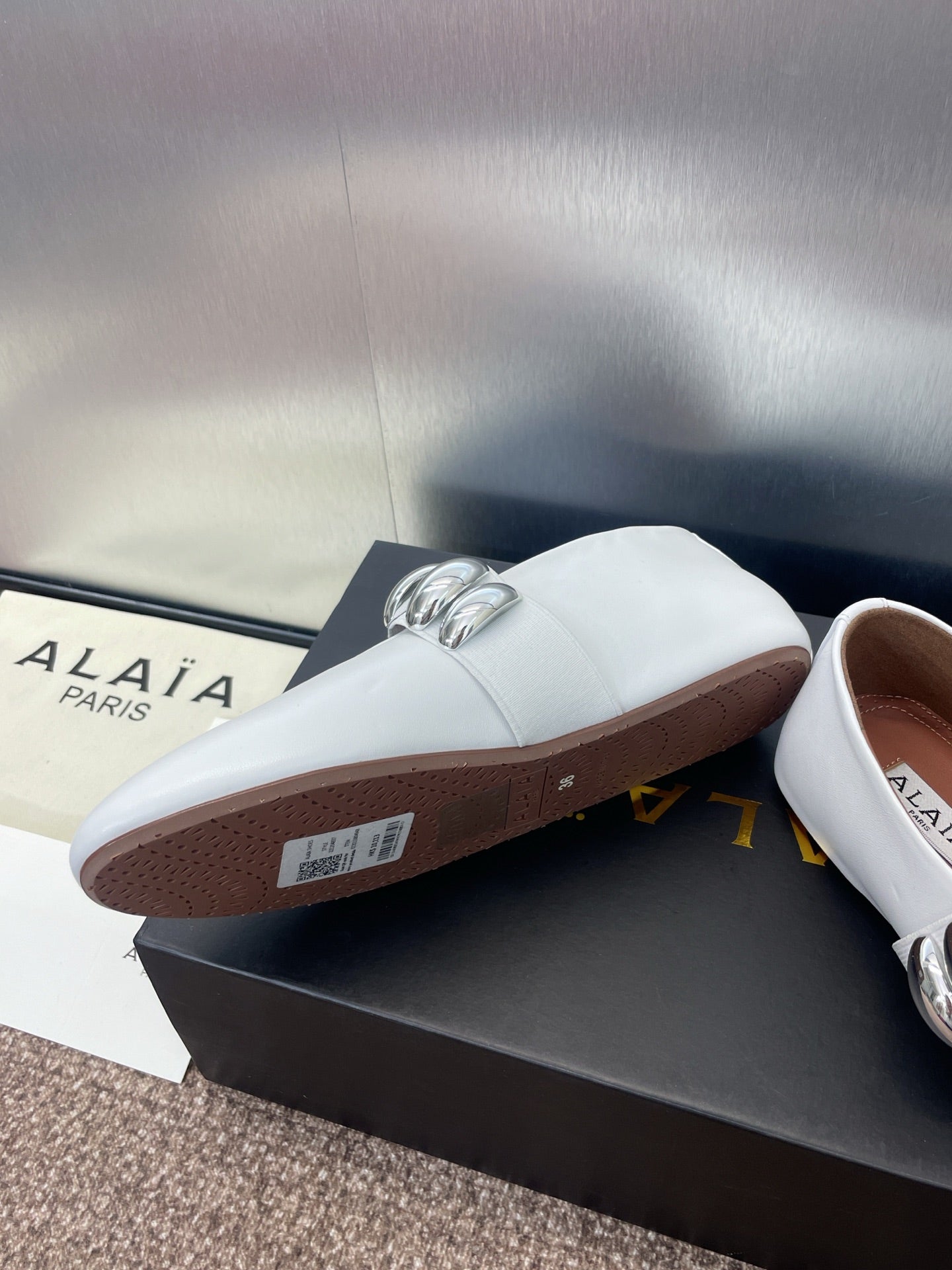 ALAIA MARY JANE FLATS 25S IN WHITE CALFSKIN WITH SILVER HARDWARE